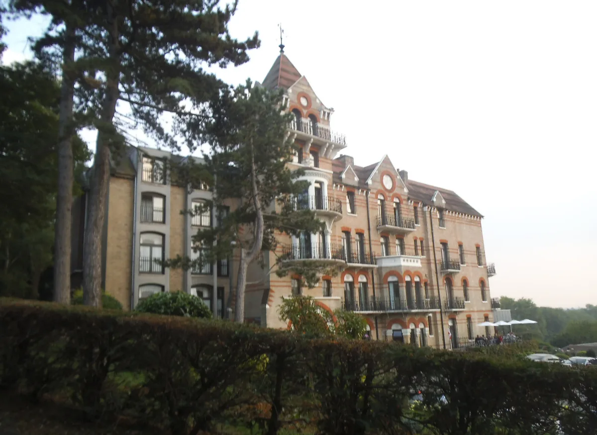 The Petersham Hotel on Nightingale Lane, seen through the pines on Richmond Hill