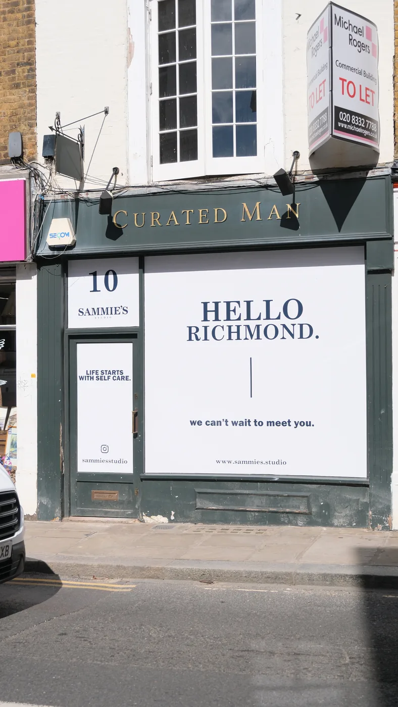 A shopfront at 10 Hill Street, Richmond, with a Hello Richmond window vinyl